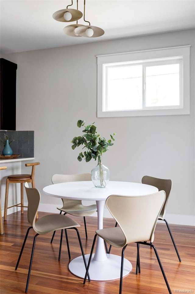2931 W 20th Ave, Denver, CO 80211 - dining space featuring plenty of natural light, wood finished floors, and baseboards