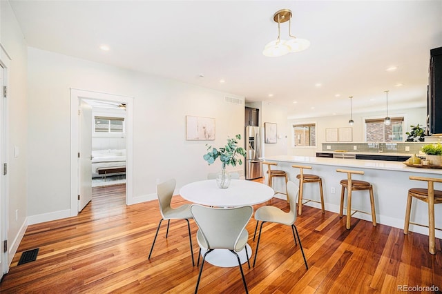2931 W 20th Ave, Denver, CO 80211 - dining space with light wood-type flooring, recessed lighting, and baseboards