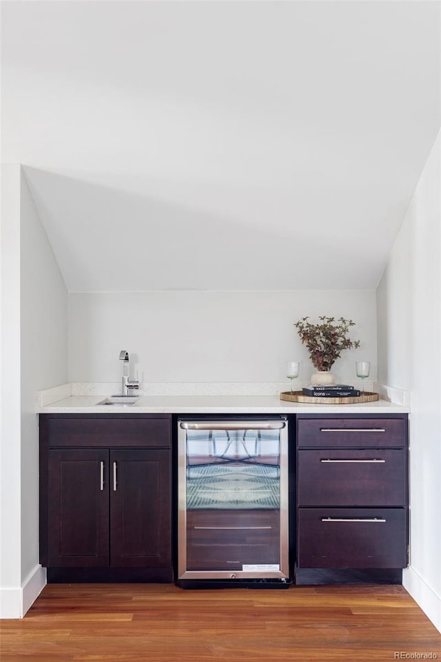 2931 W 20th Ave, Denver, CO 80211 - indoor wet bar featuring beverage cooler, wood finished floors, and baseboards