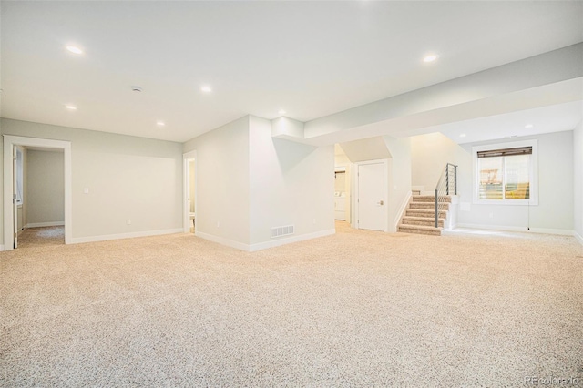 2931 W 20th Ave, Denver, CO 80211 - basement featuring stairway, light carpet, recessed lighting, and baseboards