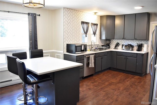 1320 S Lemay Ave, Fort Collins, CO 80524 - kitchen featuring stainless steel appliances, a sink, gray cabinets, and decorative backsplash