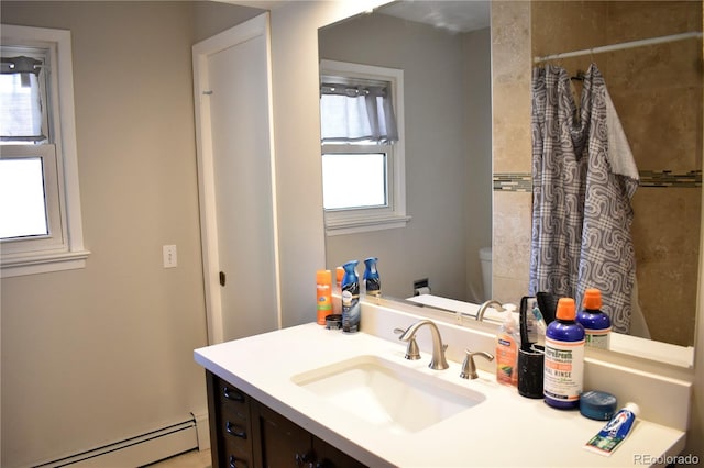 1320 S Lemay Ave, Fort Collins, CO 80524 - bathroom with a baseboard radiator, vanity, toilet, and curtained shower