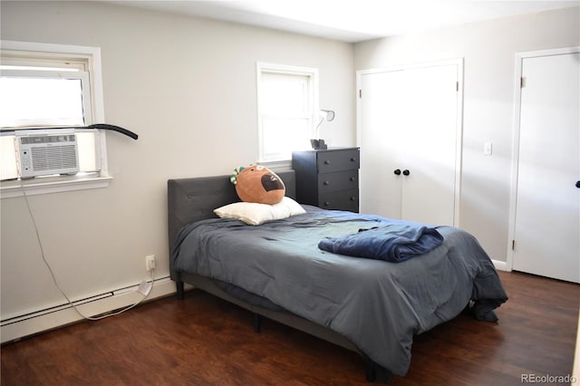 1320 S Lemay Ave, Fort Collins, CO 80524 - bedroom with wood finished floors, cooling unit, and a baseboard radiator