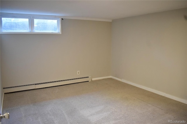 1320 S Lemay Ave, Fort Collins, CO 80524 - below grade area with a baseboard heating unit, carpet flooring, and baseboards