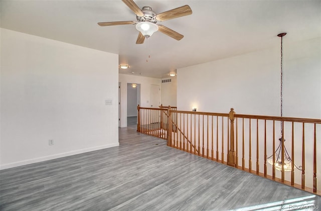 unfurnished room featuring wood-type flooring and ceiling fan