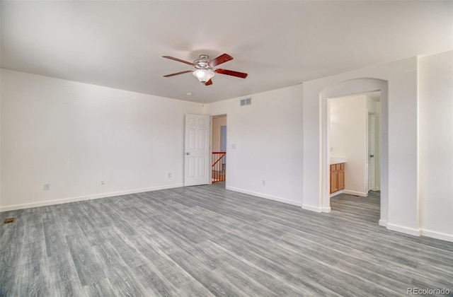 unfurnished room with hardwood / wood-style floors and ceiling fan