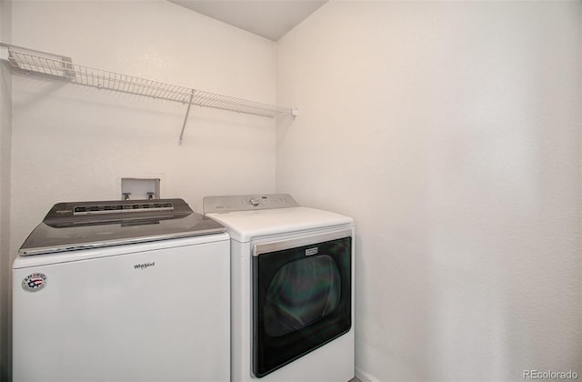 washroom with independent washer and dryer