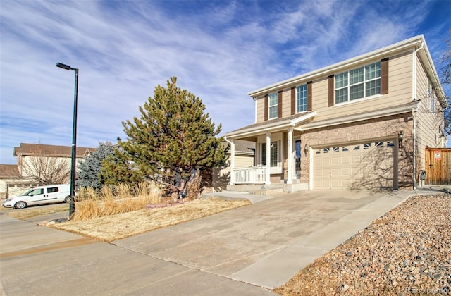 view of front of property featuring a garage and covered porch