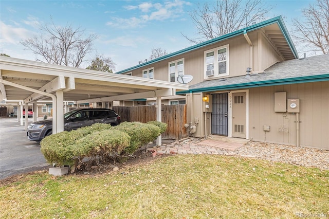 exterior space with a lawn and fence