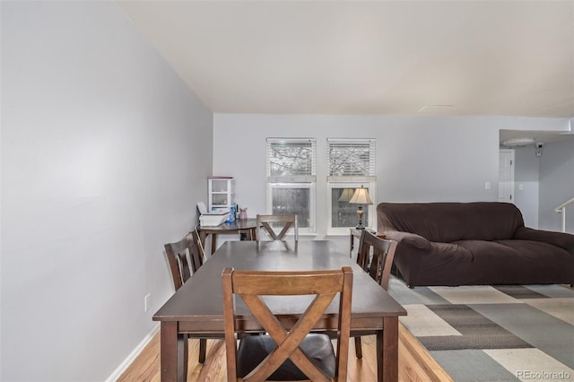 dining area featuring baseboards and wood finished floors