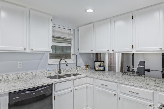 kitchen with a sink, light stone countertops, dishwasher, and white cabinetry