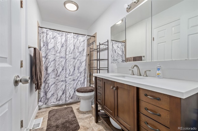 bathroom with visible vents, curtained shower, toilet, and vanity