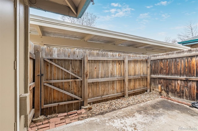 view of patio featuring a gate and fence