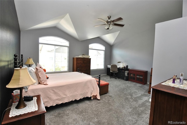 carpeted bedroom with a ceiling fan and vaulted ceiling