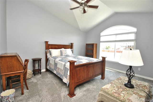 bedroom featuring carpet floors, vaulted ceiling, baseboards, and ceiling fan