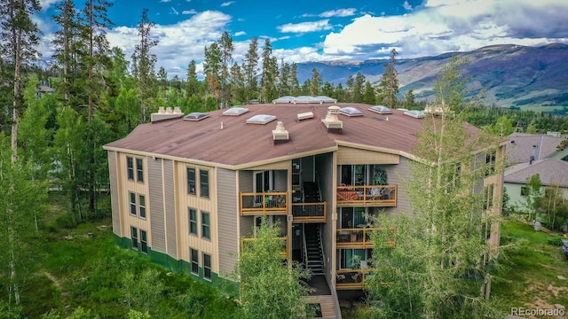 birds eye view of property with a mountain view