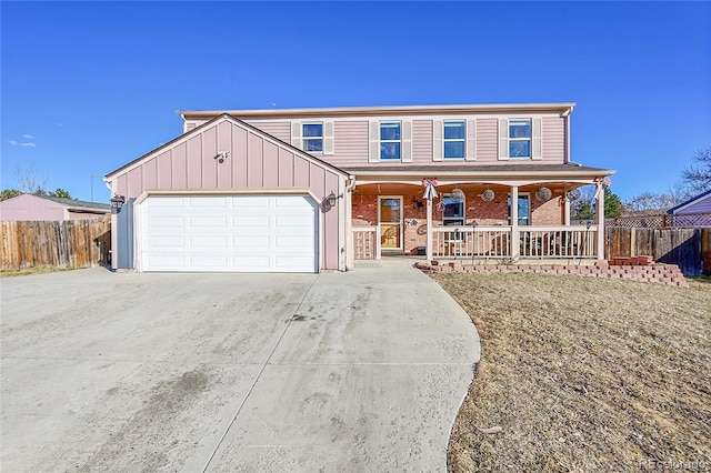 view of front of property with a garage, concrete driveway, a porch, fence, and a front lawn