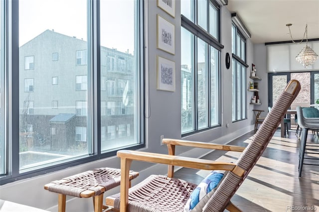 interior space with an inviting chandelier and a healthy amount of sunlight
