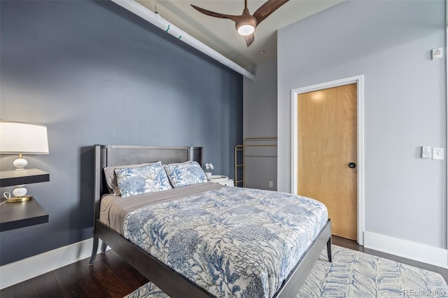 bedroom with baseboards, a ceiling fan, and wood finished floors