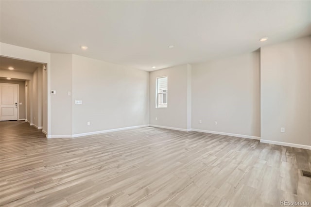 14390 Heritage Dr, Mead, CO 80504 - unfurnished room with baseboards, light wood-style flooring, and recessed lighting