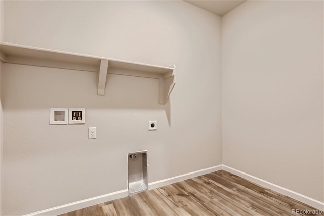 14390 Heritage Dr, Mead, CO 80504 - clothes washing area featuring hookup for a washing machine, hookup for an electric dryer, wood finished floors, and baseboards