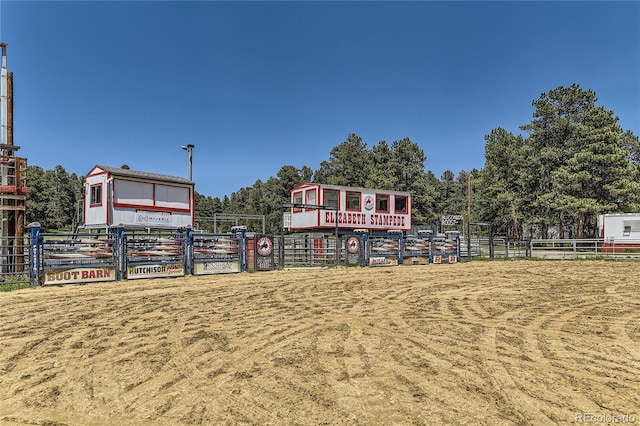 view of home's community with fence