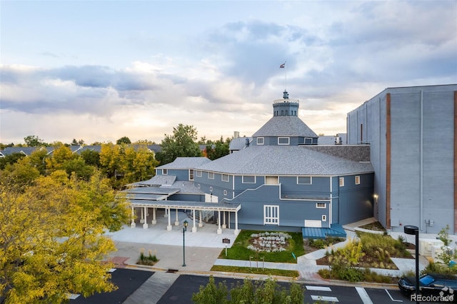 view of outdoor building at dusk