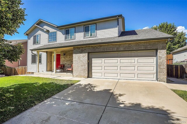 view of front facade featuring a garage and a front yard