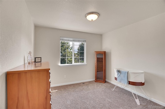 interior space featuring carpet floors, visible vents, and baseboards