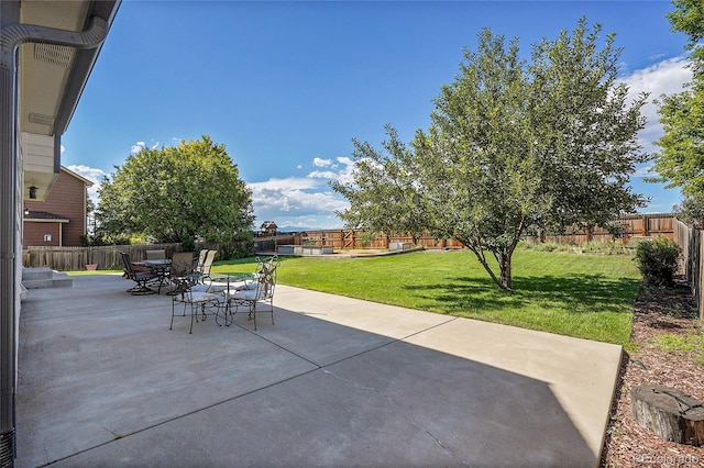 view of patio featuring outdoor dining area and a fenced backyard