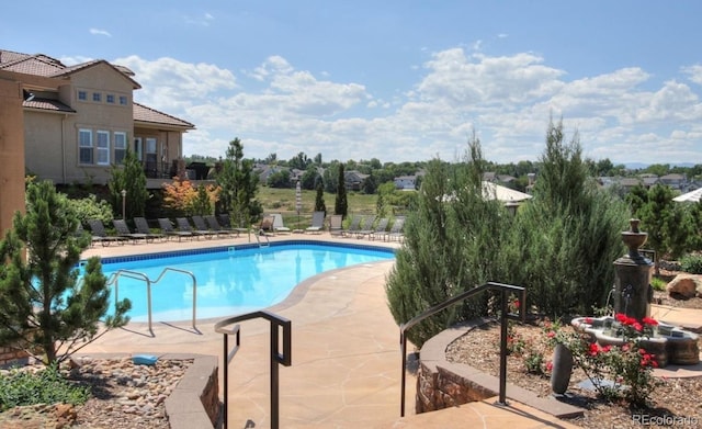 9592 Firenze Way, Highlands Ranch, CO 80126 - community pool featuring a patio