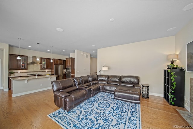 17670 W 94th Dr, Arvada, CO 80007 - living room with light wood-style floors, recessed lighting, baseboards, and visible vents