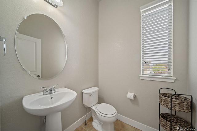 17670 W 94th Dr, Arvada, CO 80007 - bathroom with tile patterned flooring, a sink, baseboards, and toilet