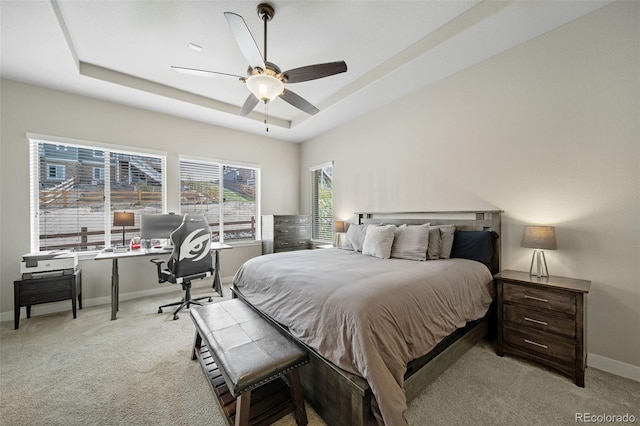 17670 W 94th Dr, Arvada, CO 80007 - carpeted bedroom with baseboards, a raised ceiling, and ceiling fan