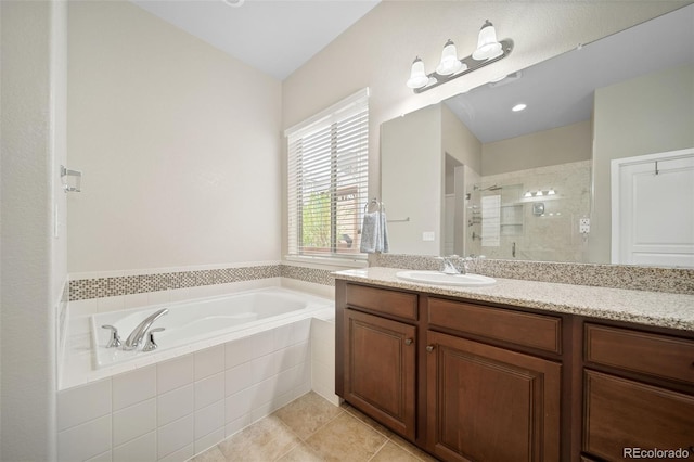 17670 W 94th Dr, Arvada, CO 80007 - full bath featuring tile patterned flooring, a shower stall, a bath, and vanity