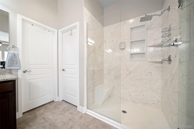 17670 W 94th Dr, Arvada, CO 80007 - bathroom with vanity, tile patterned flooring, and a tile shower