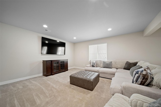 17670 W 94th Dr, Arvada, CO 80007 - carpeted living room with recessed lighting, baseboards, visible vents, and a glass covered fireplace