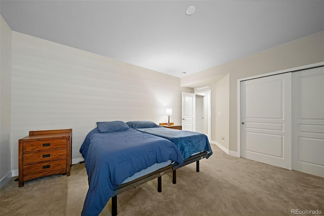 17670 W 94th Dr, Arvada, CO 80007 - bedroom with baseboards, carpet, and a closet