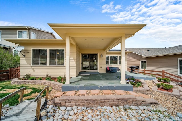 17670 W 94th Dr, Arvada, CO 80007 - property entrance featuring fence and a patio area