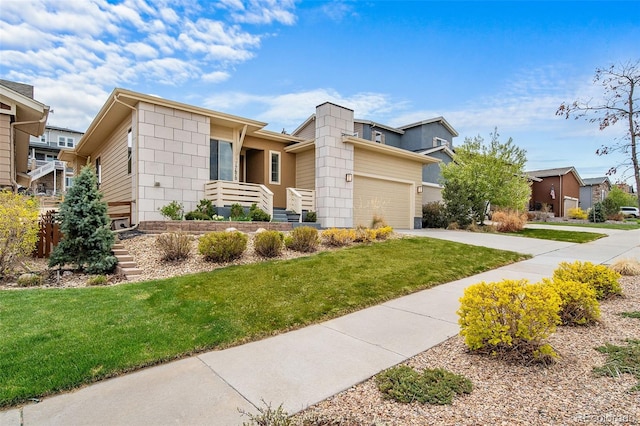 17670 W 94th Dr, Arvada, CO 80007 - view of front of home with a garage, a front lawn, and driveway