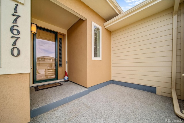 17670 W 94th Dr, Arvada, CO 80007 - property entrance featuring stucco siding