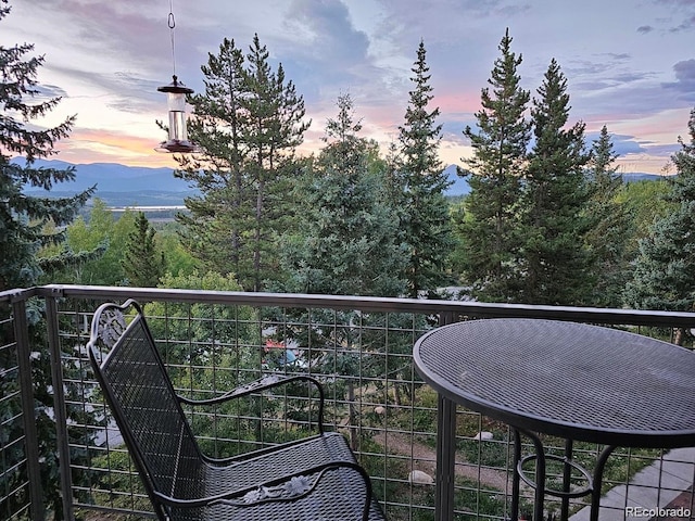 balcony at dusk with a mountain view