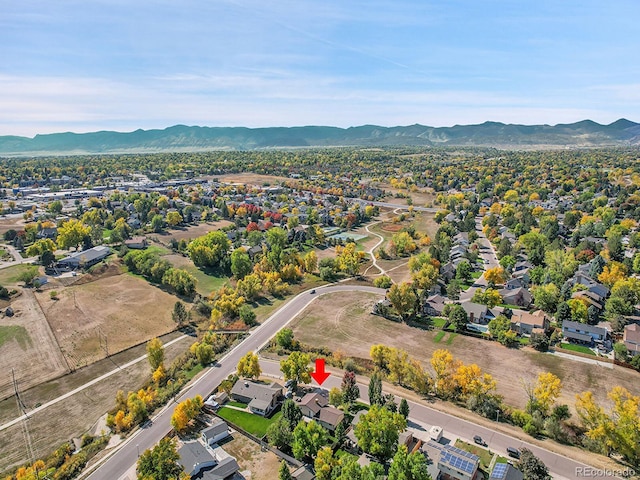 birds eye view of property featuring a mountain view