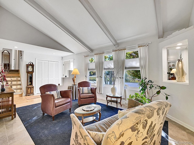 living room with lofted ceiling with beams and light tile patterned floors