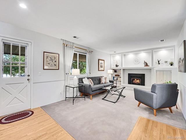 living room featuring a fireplace and hardwood / wood-style flooring