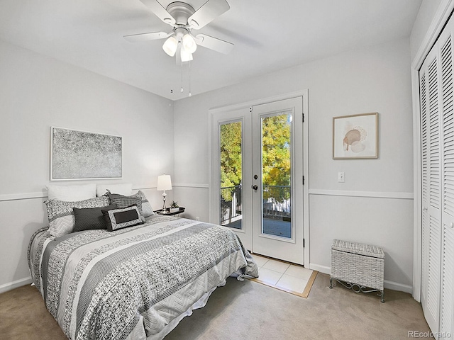 carpeted bedroom with access to outside, french doors, a closet, and ceiling fan