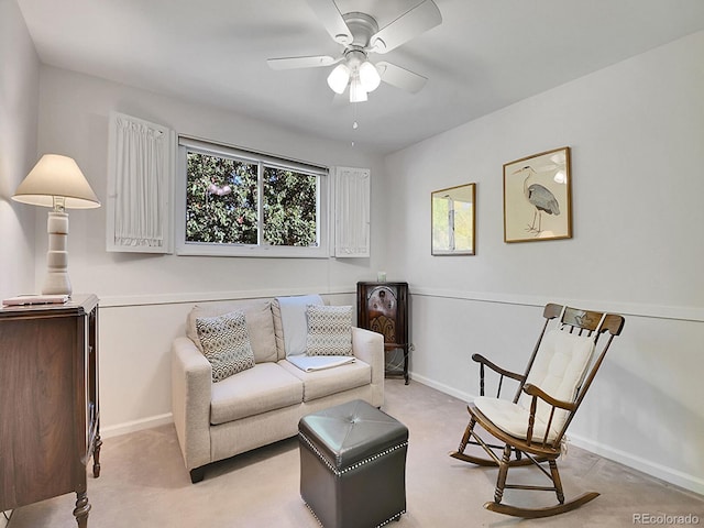 carpeted living room with a wealth of natural light and ceiling fan