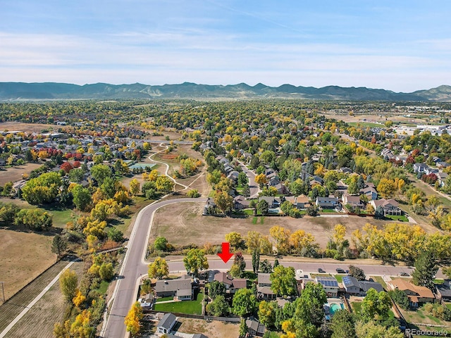 birds eye view of property featuring a mountain view