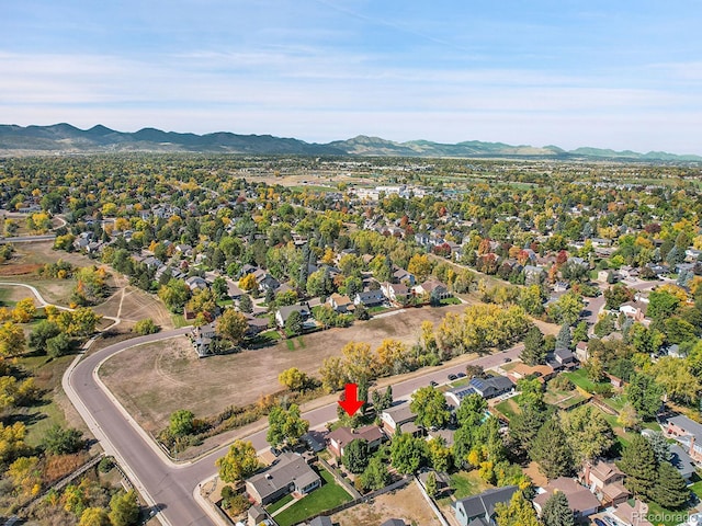 birds eye view of property featuring a mountain view