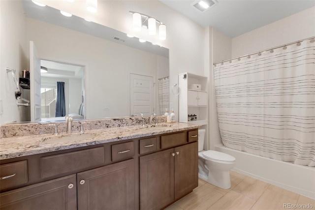 full bathroom featuring tile patterned floors, vanity, shower / bath combo, and toilet